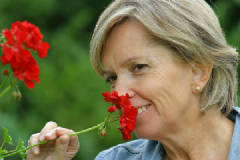 womansmellingflower.jpg
